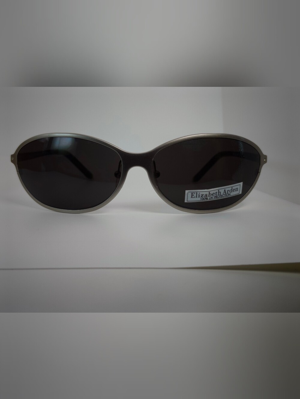 Elizabeth Arden Oval Wrap Sunglasses with Dark Lenses and Silver Frame